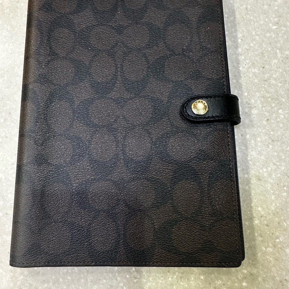 Coach cover and notebook
